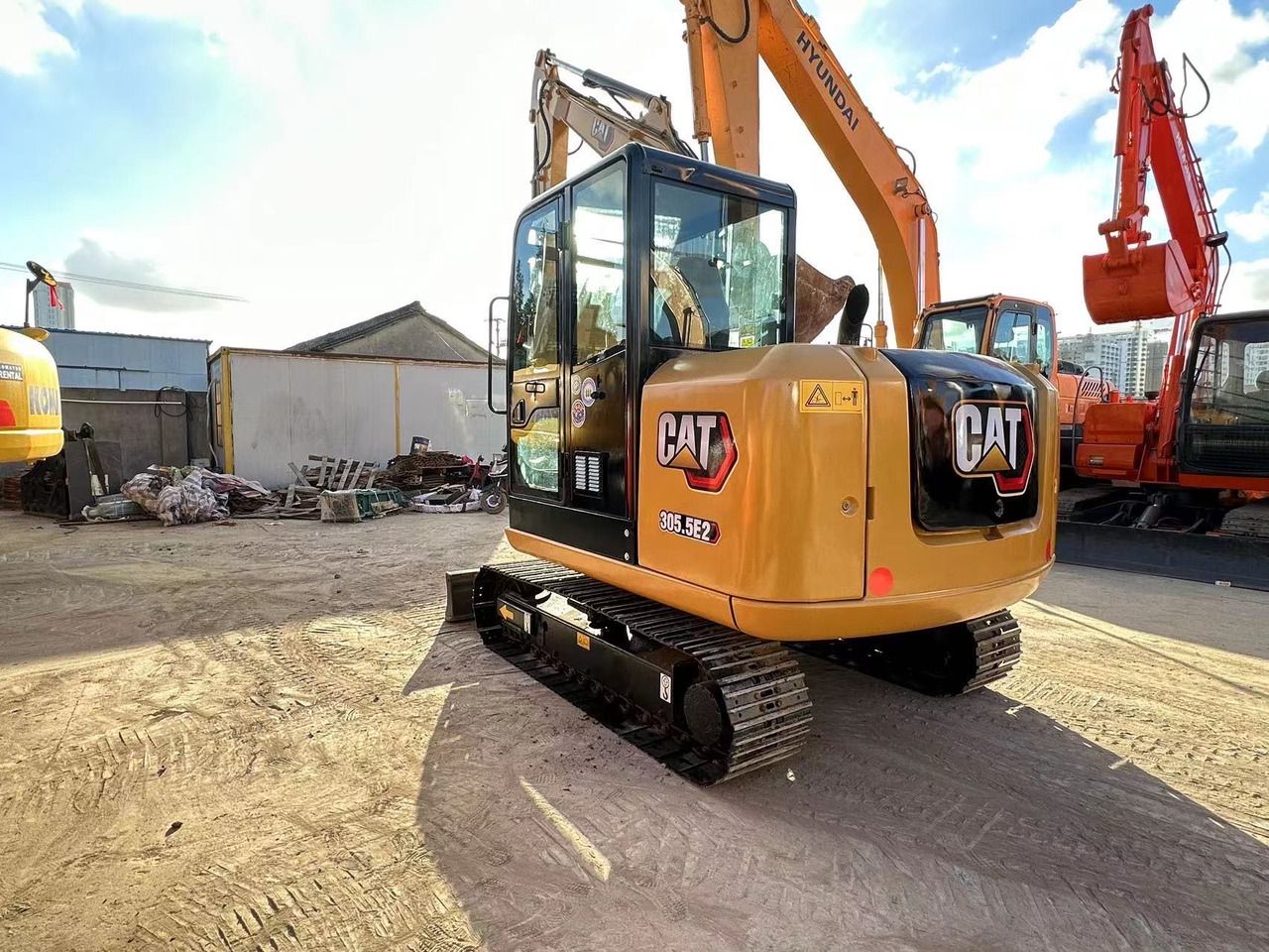 2022 Caterpillar 305.5E2 mini excavator, rear three-quarter view 2022 Caterpillar 305.5E2 mini excavator, rear three-quarter view