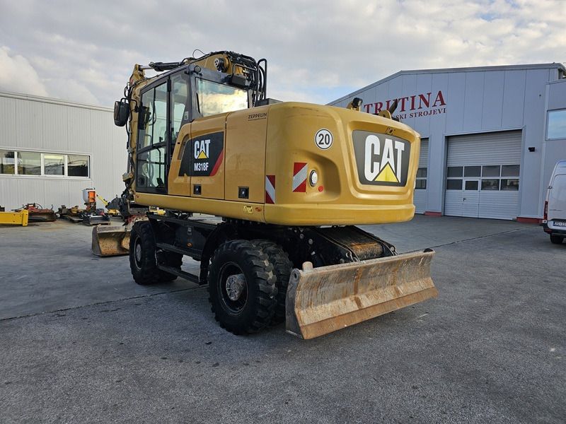 2016 Caterpillar M318F wheel excavator, rear three-quarter view 2016 Caterpillar M318F wheel excavator, rear three-quarter view