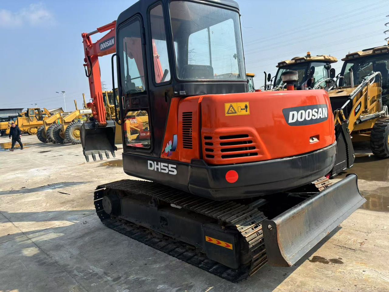 2020 Doosan DH55 mini excavator, front three-quarter view 2020 Doosan DH55 mini excavator, front three-quarter view