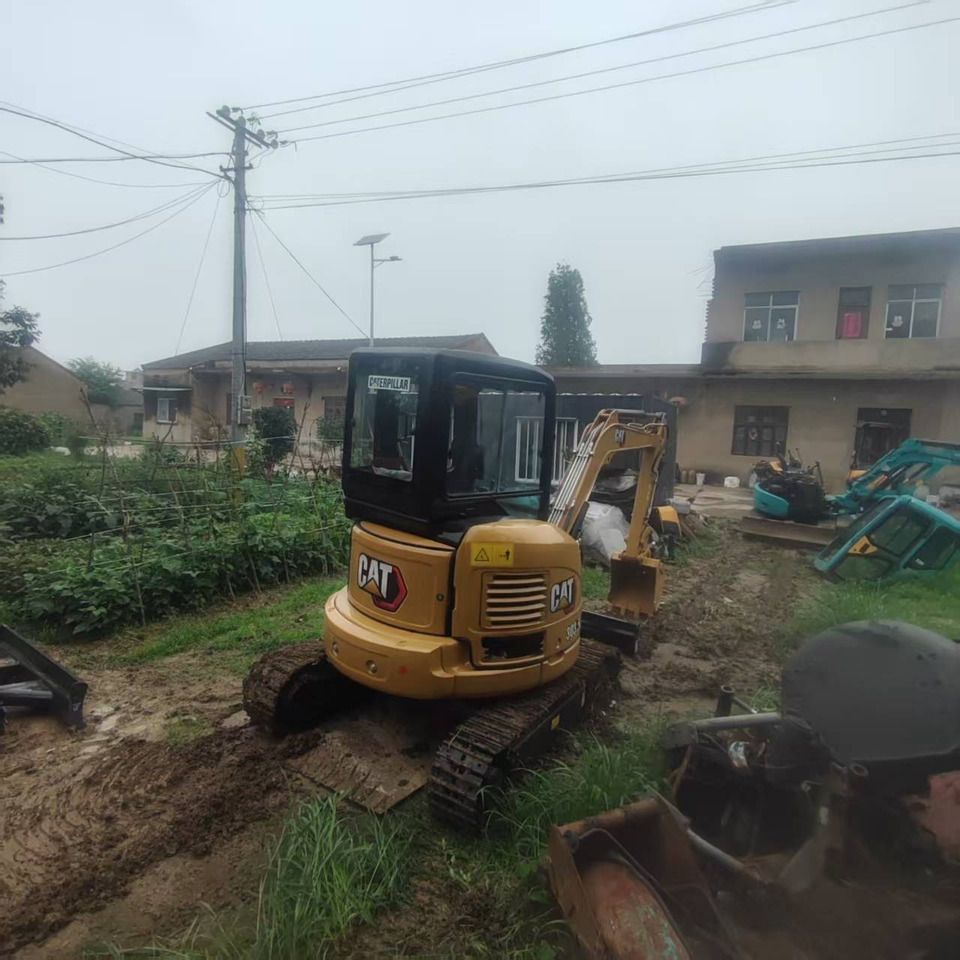 2021 Caterpillar 303.5 mini excavator, rear three-quarter view 2021 Caterpillar 303.5 mini excavator, rear three-quarter view