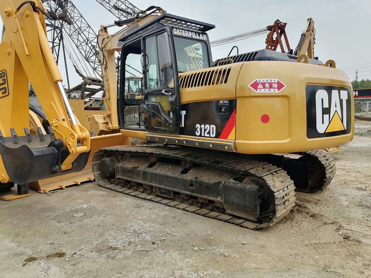 2020 Caterpillar 312D excavator, rear three-quarter view 2020 Caterpillar 312D excavator, rear three-quarter view
