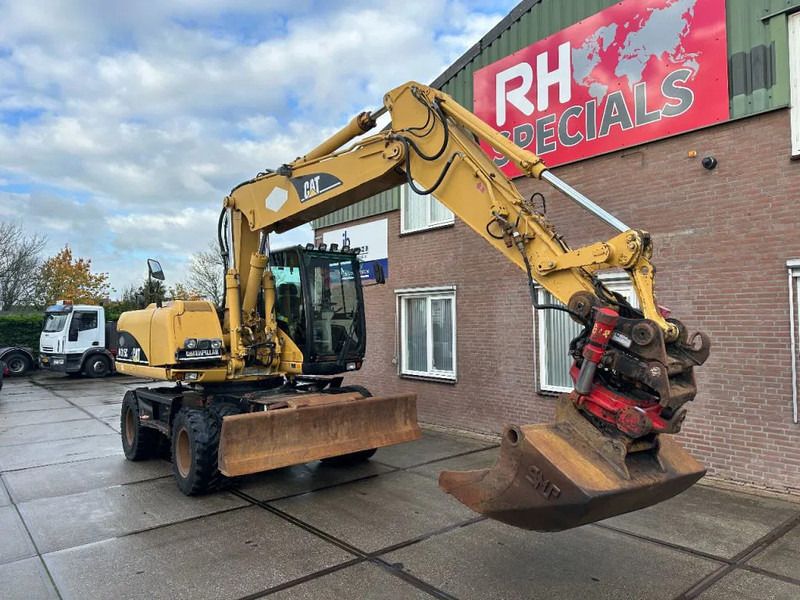 2003 Caterpillar M315C wheel excavator, side view 2003 Caterpillar M315C wheel excavator, side view