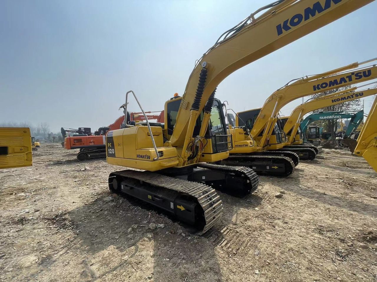 2022 Komatsu PC120-8 crawler excavator, rear three-quarter view 2022 Komatsu PC120-8 crawler excavator, rear three-quarter view