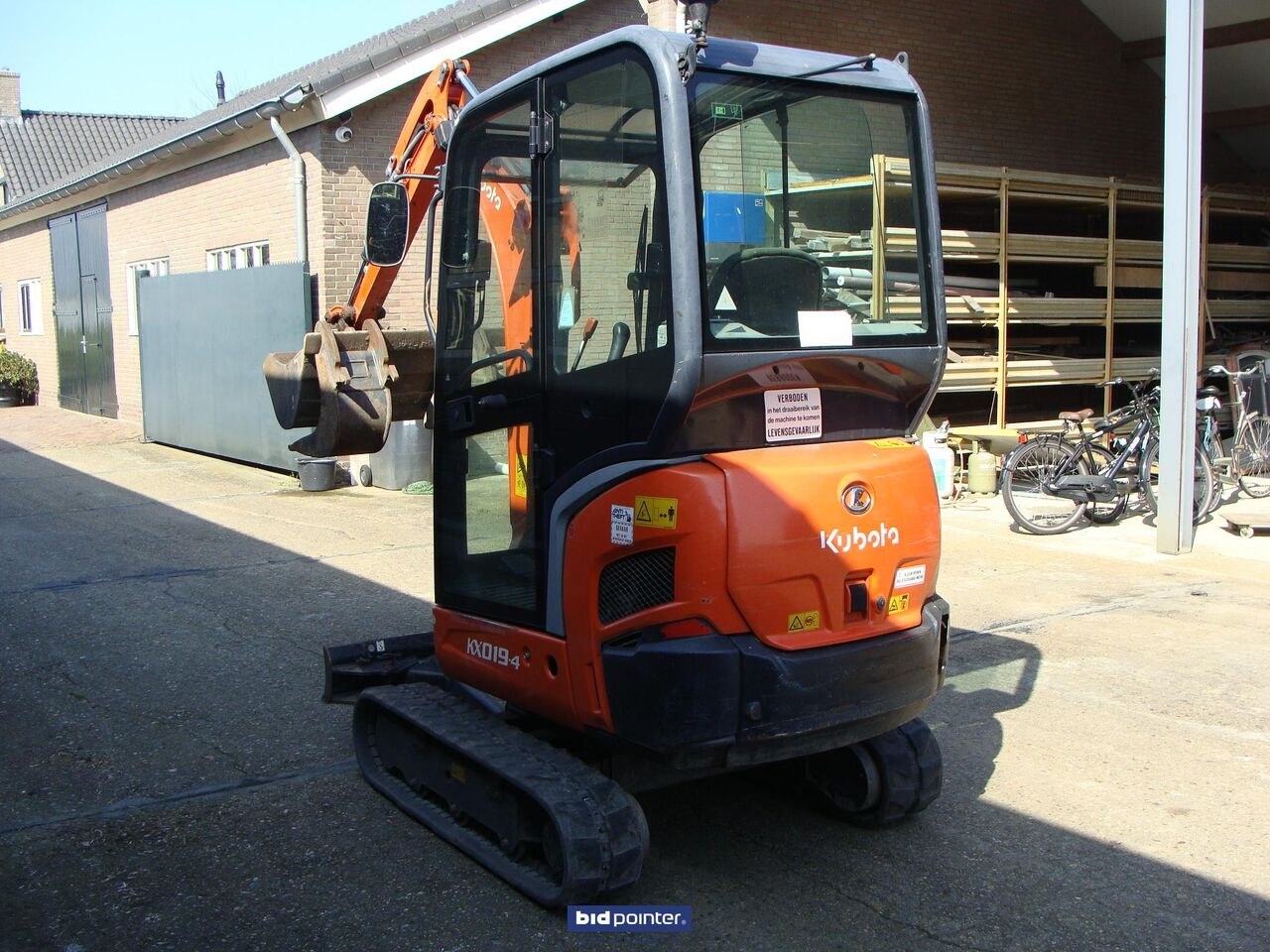 2015 Kubota KX019-4 mini excavator, rear three-quarter view