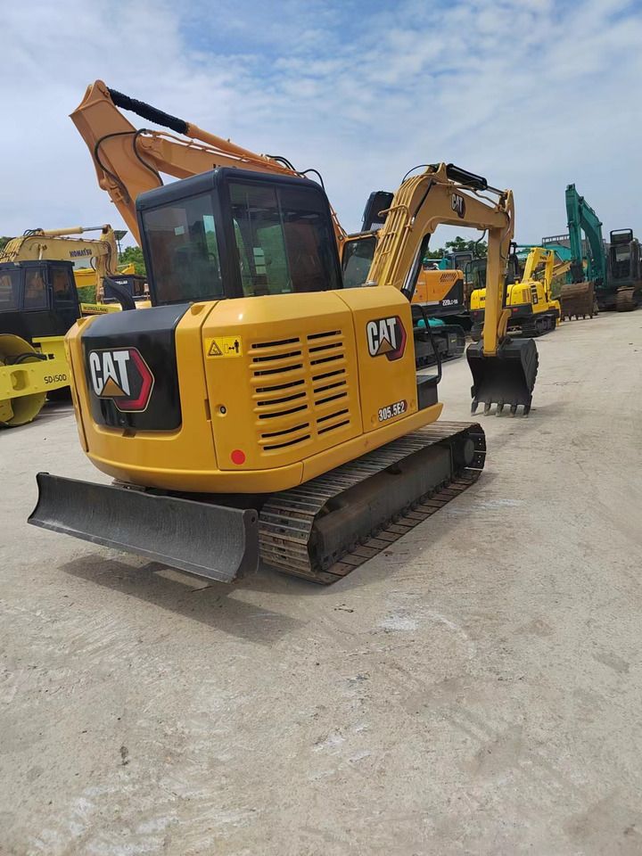 2021 Caterpillar 305.5E2 mini excavator, rear three-quarter view