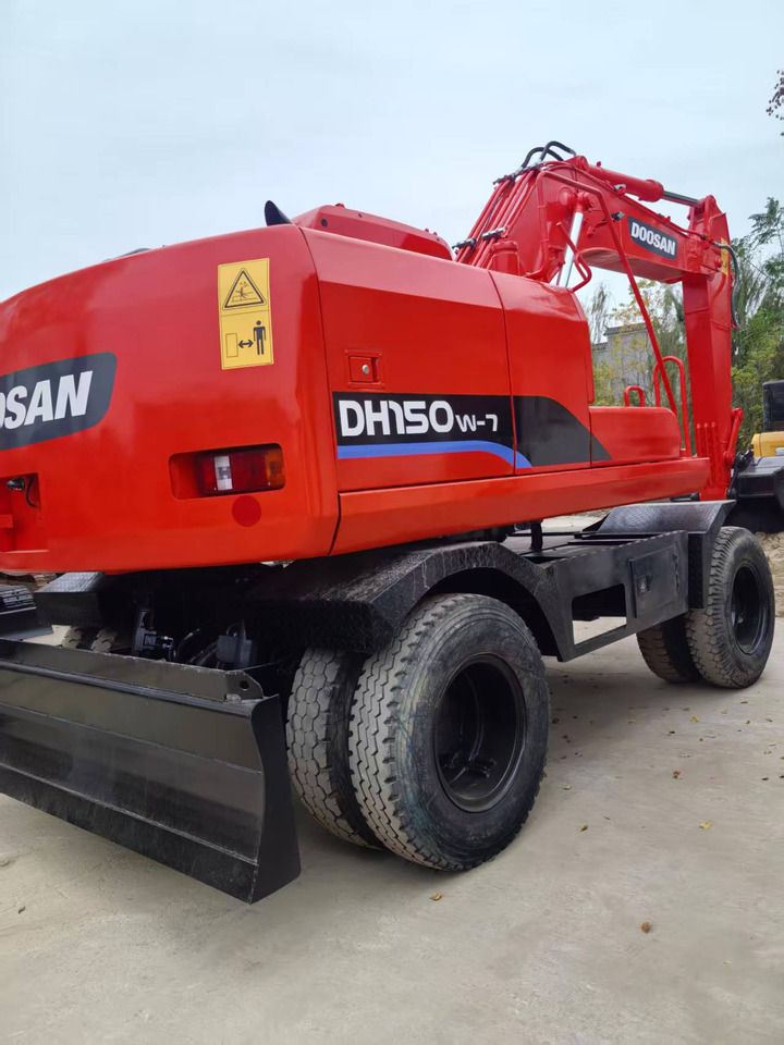 Doosan DH150W-7 wheel excavator, rear three-quarter view Doosan DH150W-7 wheel excavator, rear three-quarter view