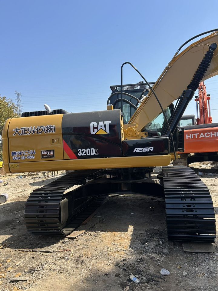 Caterpillar 320D2 rupsgraafmachine uit 2024, zijaanzicht Caterpillar 320D2 rupsgraafmachine uit 2024, zijaanzicht