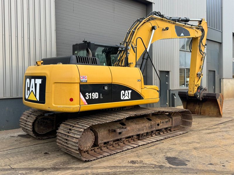 2011 Caterpillar 319DL crawler excavator, rear three-quarter view