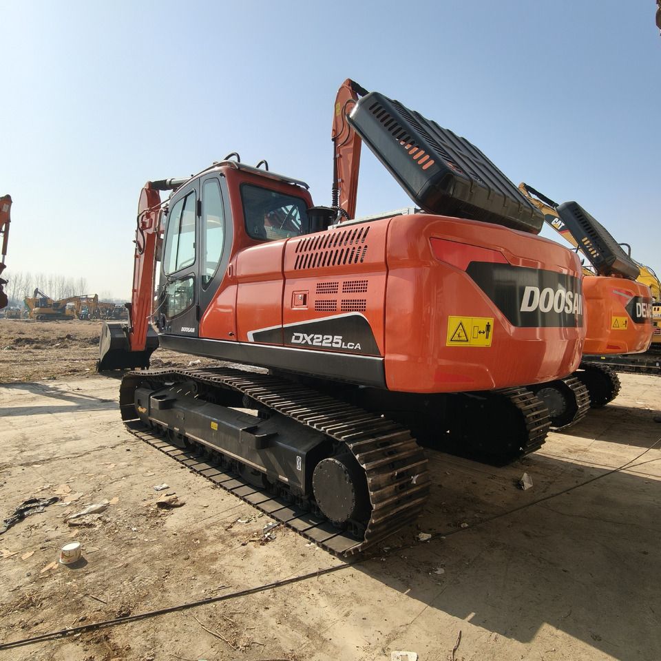 2024 Doosan DX225LCA crawler excavator, rear three-quarter view 2024 Doosan DX225LCA crawler excavator, rear three-quarter view