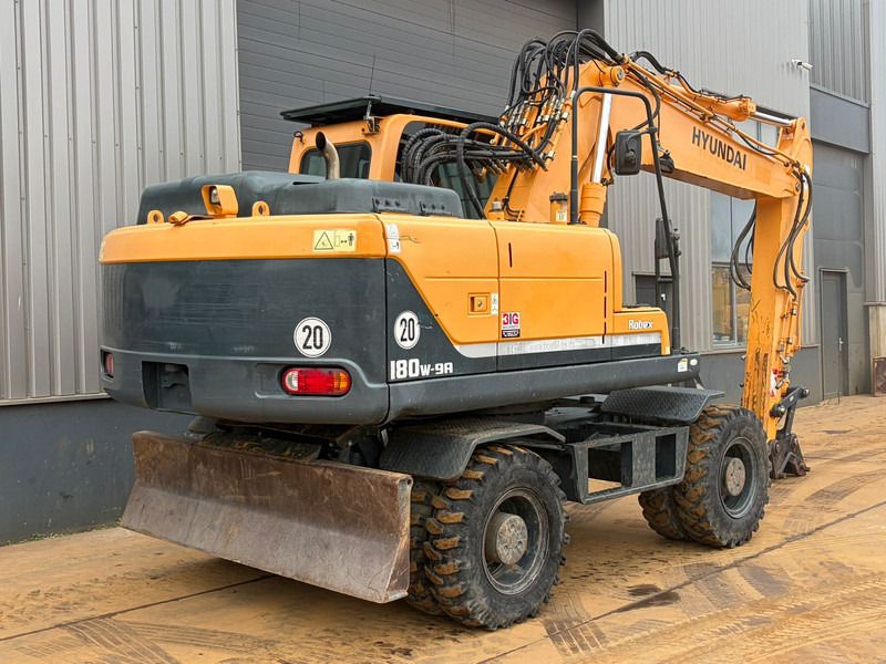2014 Hyundai R180W-9A wheel excavator rear three-quarter view