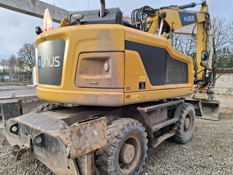 2021 Caterpillar M315F wheel excavator, rear three-quarter view