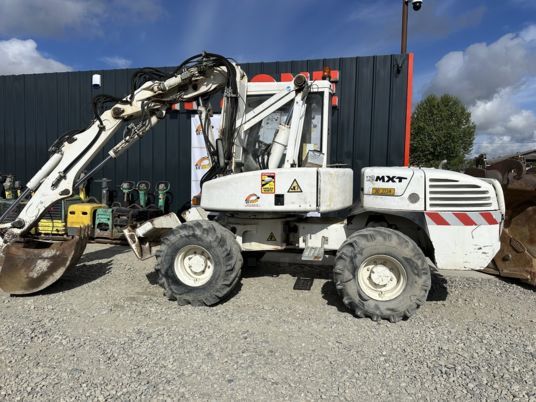 2005 Mecalac 12MXT wheel excavator side view 2005 Mecalac 12MXT wheel excavator side view