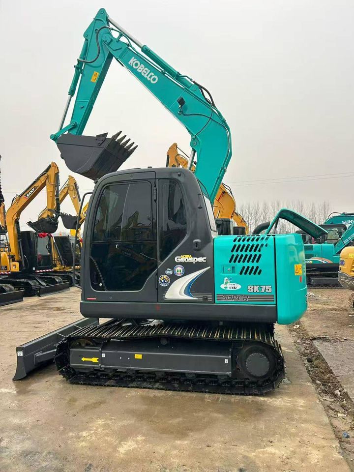 Kobelco SK75 mini excavator, side view Kobelco SK75 mini excavator, side view