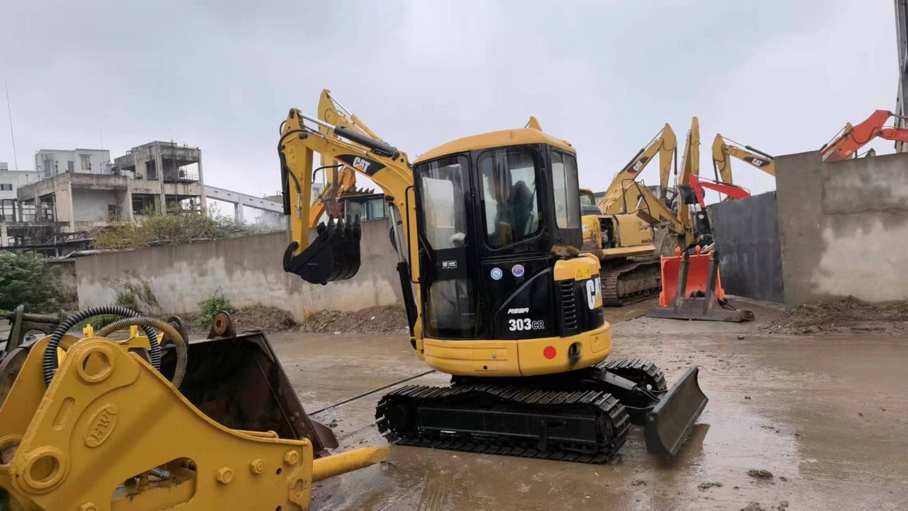 Caterpillar 303CR mini excavator, front three-quarter view Caterpillar 303CR mini excavator, front three-quarter view