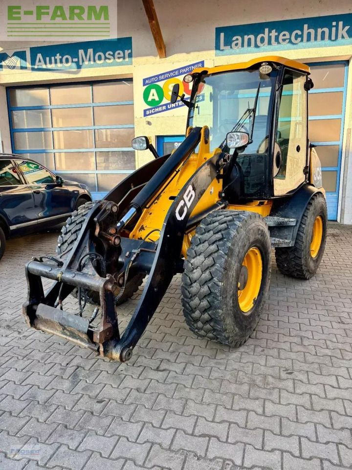 2011 JCB 409 wheel loader, front three-quarter view