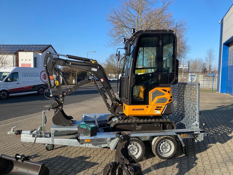 Berger Kraus BK2000NKSR mini excavator on trailer, side view Berger Kraus BK2000NKSR mini excavator on trailer, side view