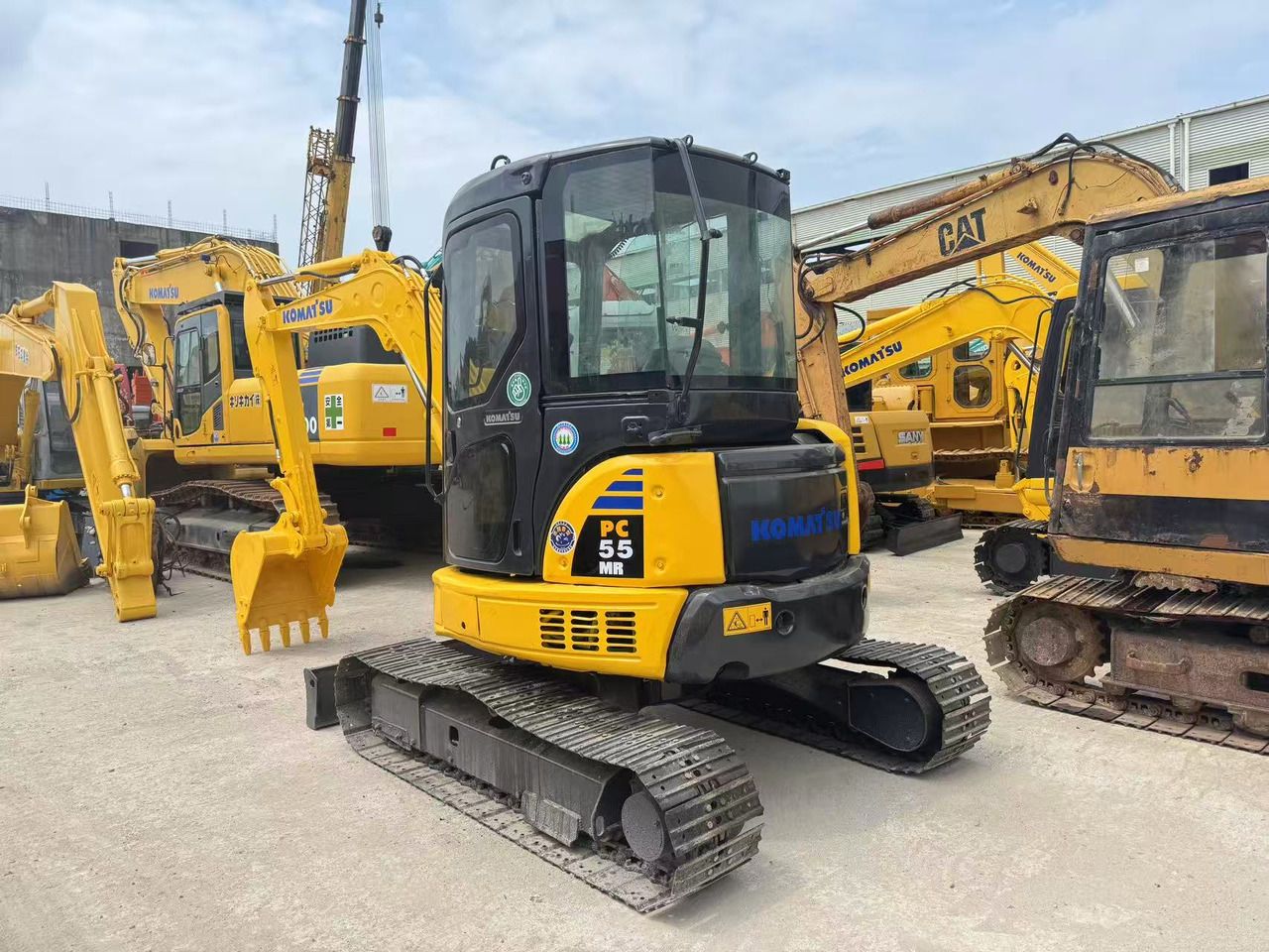 2018 Komatsu PC55MR mini excavator, front three-quarter view