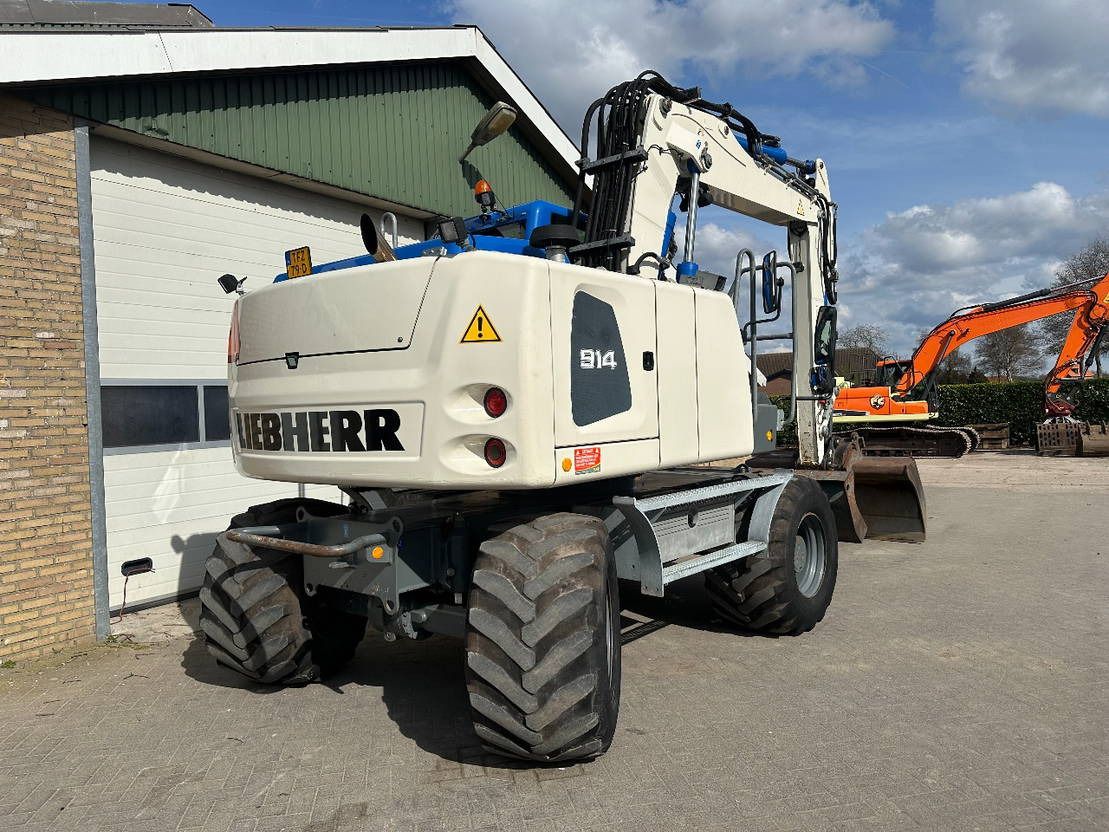 2015 Liebherr A914 wheel excavator, rear three-quarter view 2015 Liebherr A914 wheel excavator, rear three-quarter view