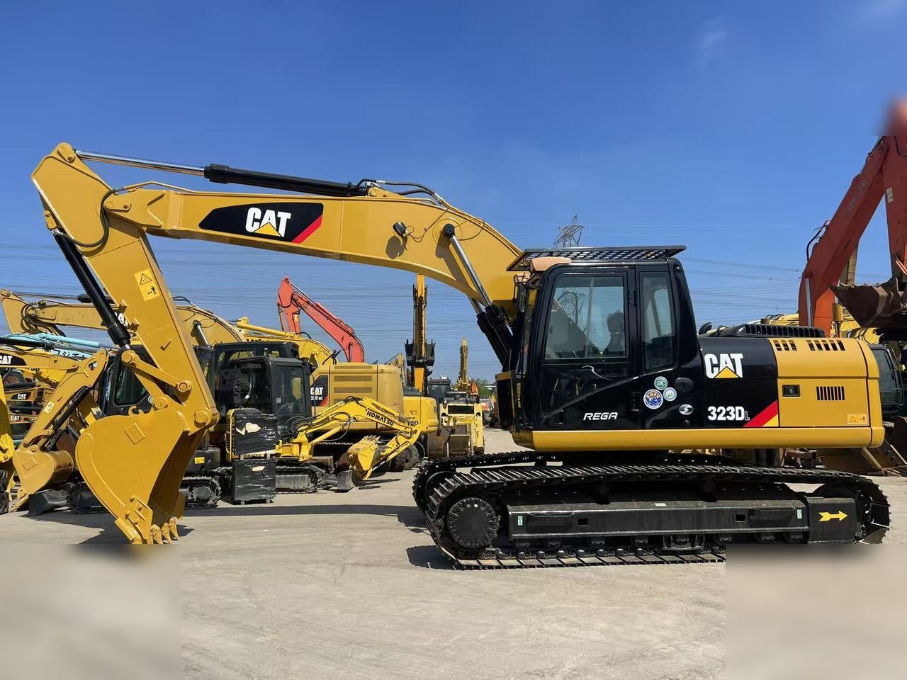 2023 Caterpillar 323DL crawler excavator, side profile view
