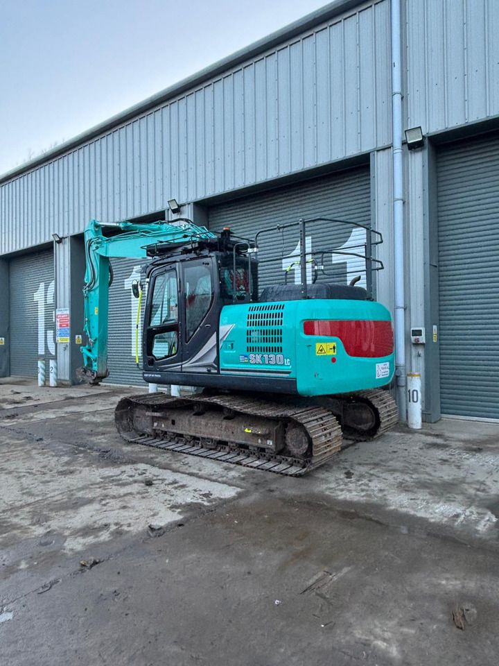 2022 Kobelco SK130LC-11 crawler excavator, rear three-quarter view 2022 Kobelco SK130LC-11 crawler excavator, rear three-quarter view