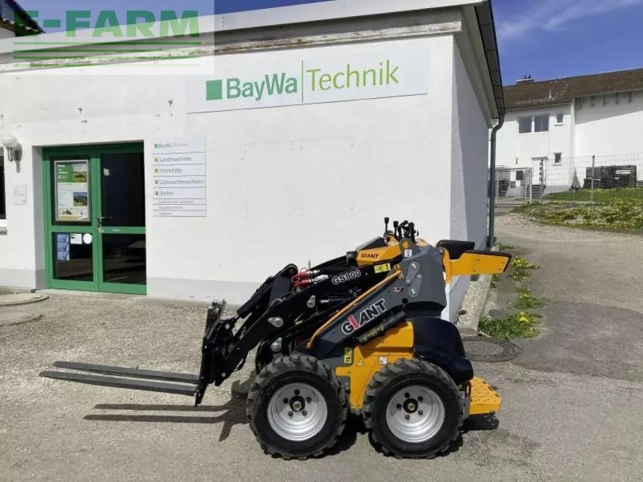 2024 Giant GS900 mini excavator, side view with pallet forks