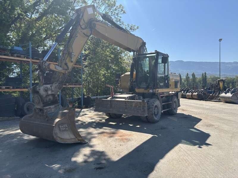 2014 Caterpillar M318D wheel excavator, front three-quarter view 2014 Caterpillar M318D wheel excavator, front three-quarter view