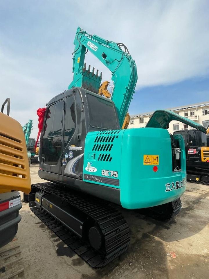 2024 Kobelco SK75 crawler excavator, rear three-quarter view