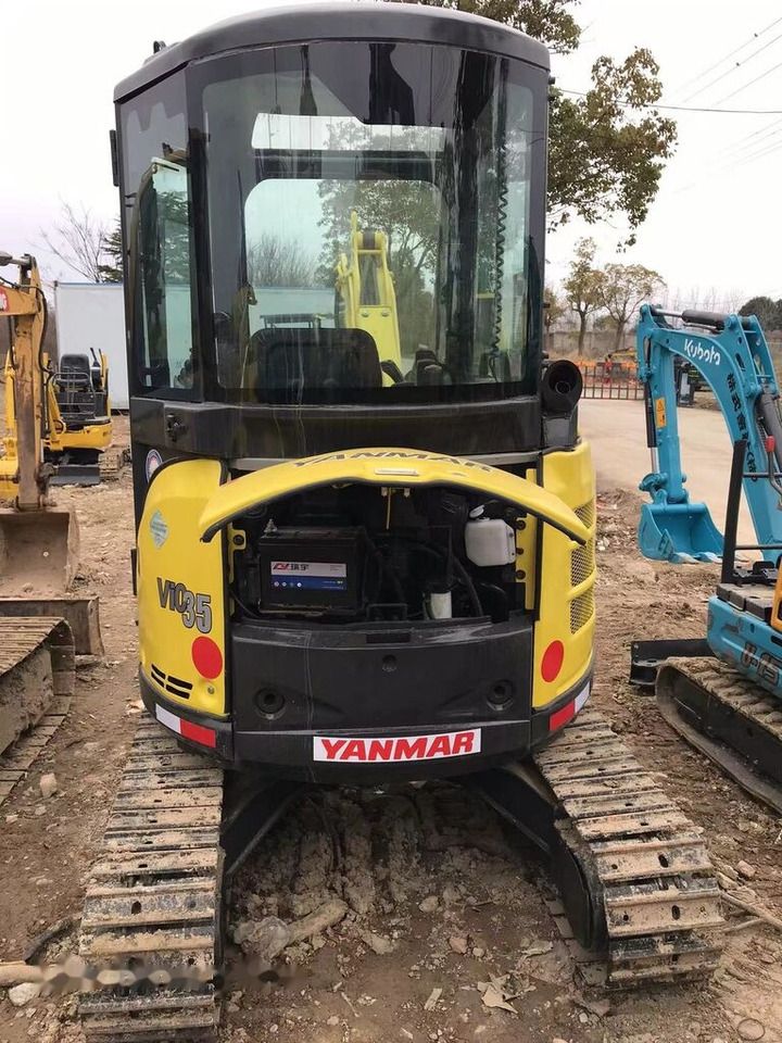 2022 Yanmar VIO35 mini excavator, rear view with engine cover open 2022 Yanmar VIO35 mini excavator, rear view with engine cover open