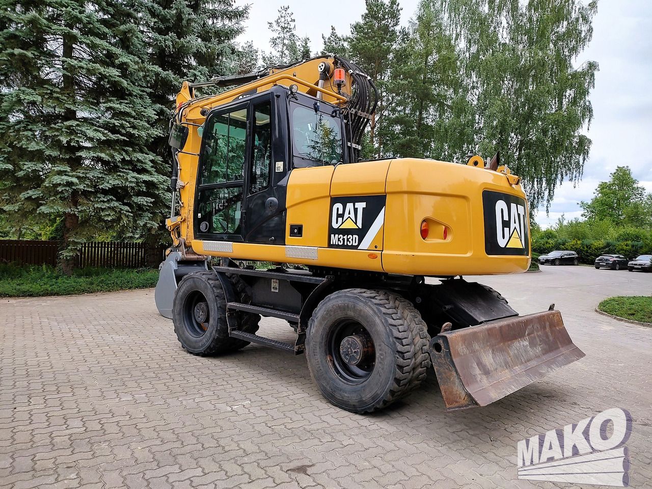 2016 Caterpillar M313D wheel excavator, rear three-quarter view 2016 Caterpillar M313D wheel excavator, rear three-quarter view