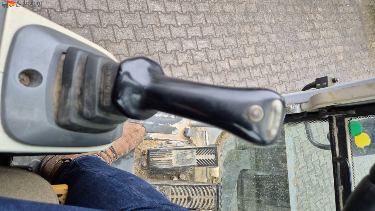 2009 New Holland MH 2.6 wheel excavator cab interior view 2009 New Holland MH 2.6 wheel excavator cab interior view