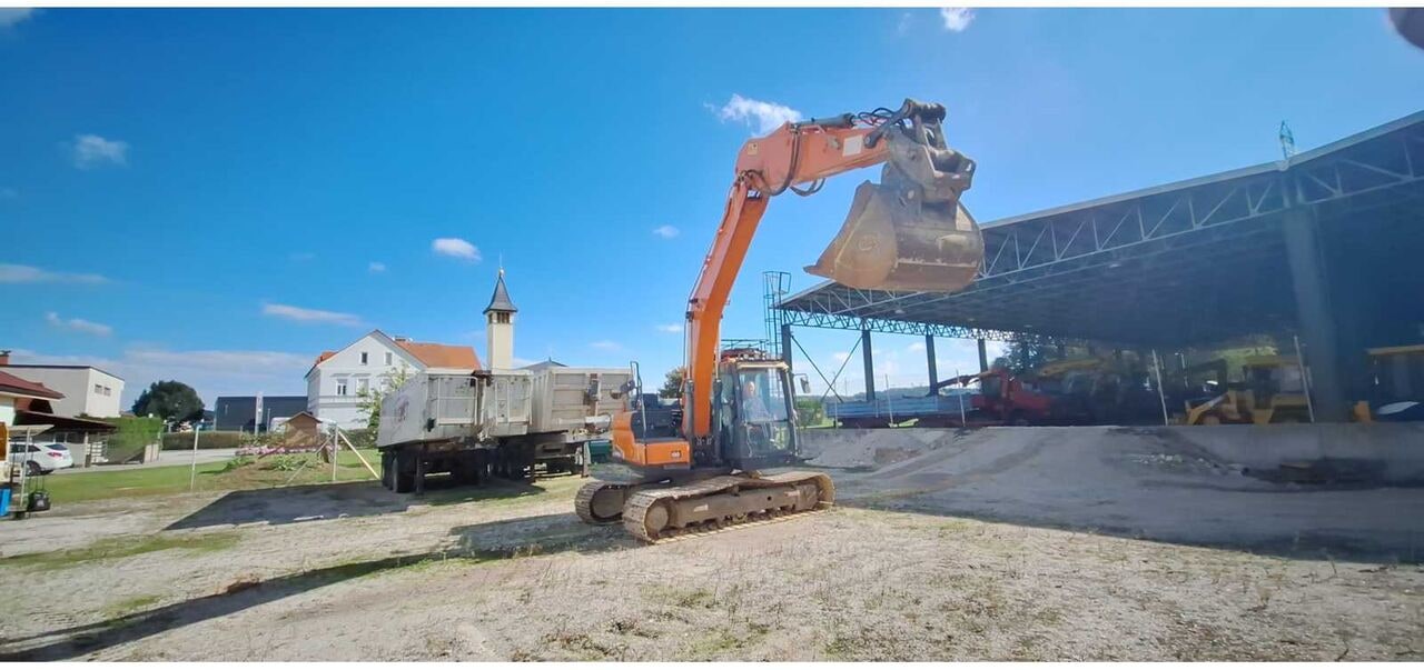 Doosan DX140LC-5 crawler excavator, side view