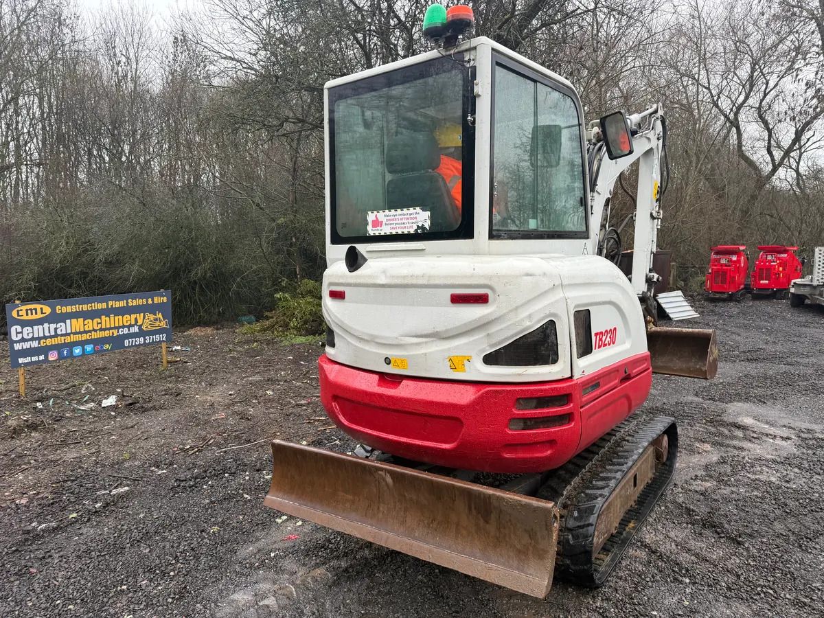 2018 Takeuchi TB230 mini excavator, rear three-quarter view 2018 Takeuchi TB230 mini excavator, rear three-quarter view