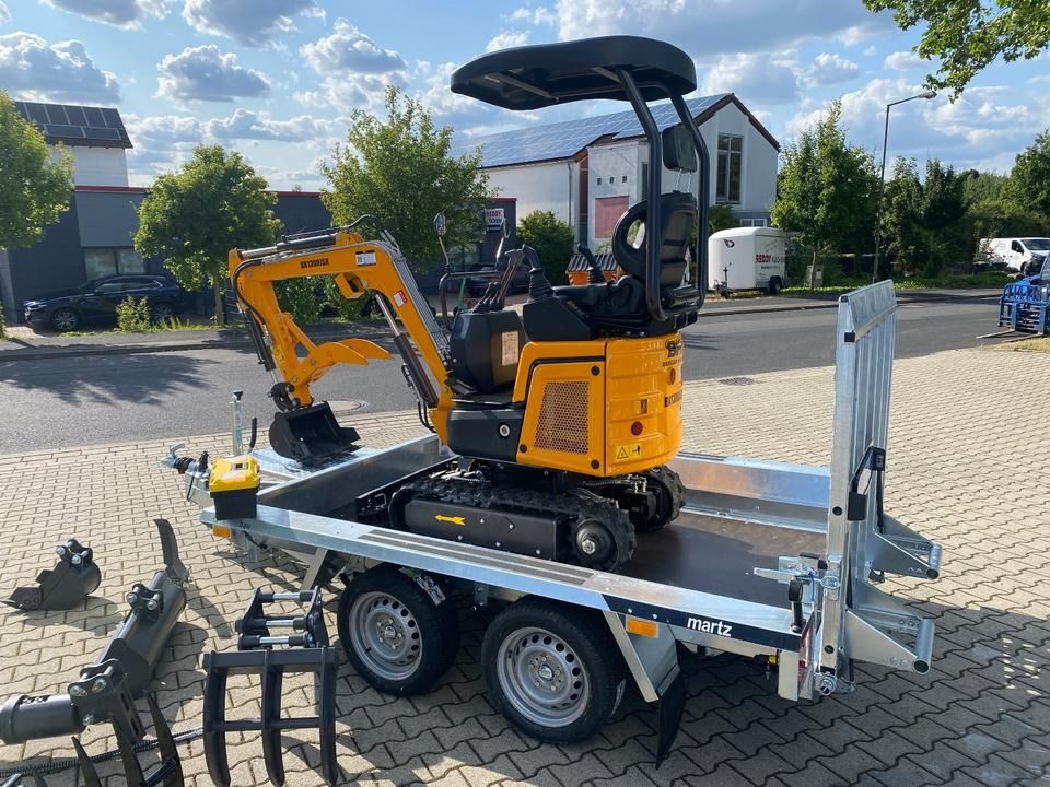 2026 Berger Kraus BK1300JSR mini excavator on trailer, rear three-quarter view 2026 Berger Kraus BK1300JSR mini excavator on trailer, rear three-quarter view