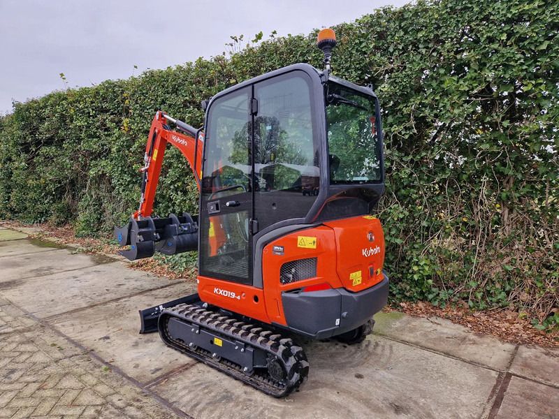 2025 Kubota KX019-4 mini excavator, three-quarter rear view 2025 Kubota KX019-4 mini excavator, three-quarter rear view