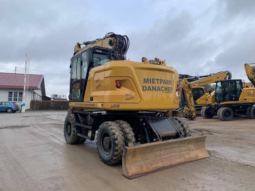 2023 Caterpillar M317-07B wheel excavator, rear three-quarter view