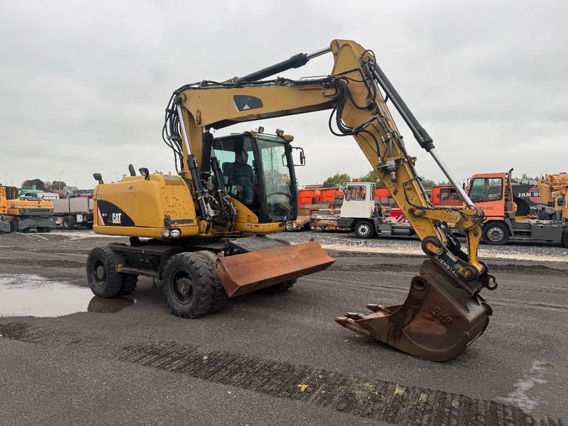 2008 Caterpillar M313D wheel excavator, side profile view 2008 Caterpillar M313D wheel excavator, side profile view