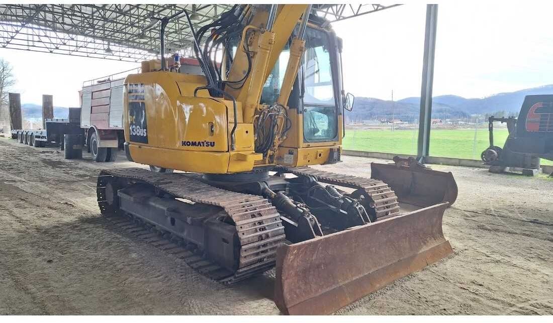 Komatsu PC138US-8 crawler excavator, front three-quarter view Komatsu PC138US-8 crawler excavator, front three-quarter view
