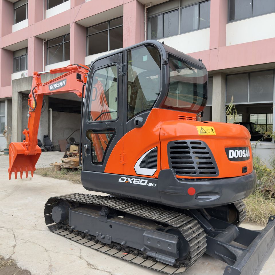 Doosan DX60-9C mini excavator, front three-quarter view Doosan DX60-9C mini excavator, front three-quarter view