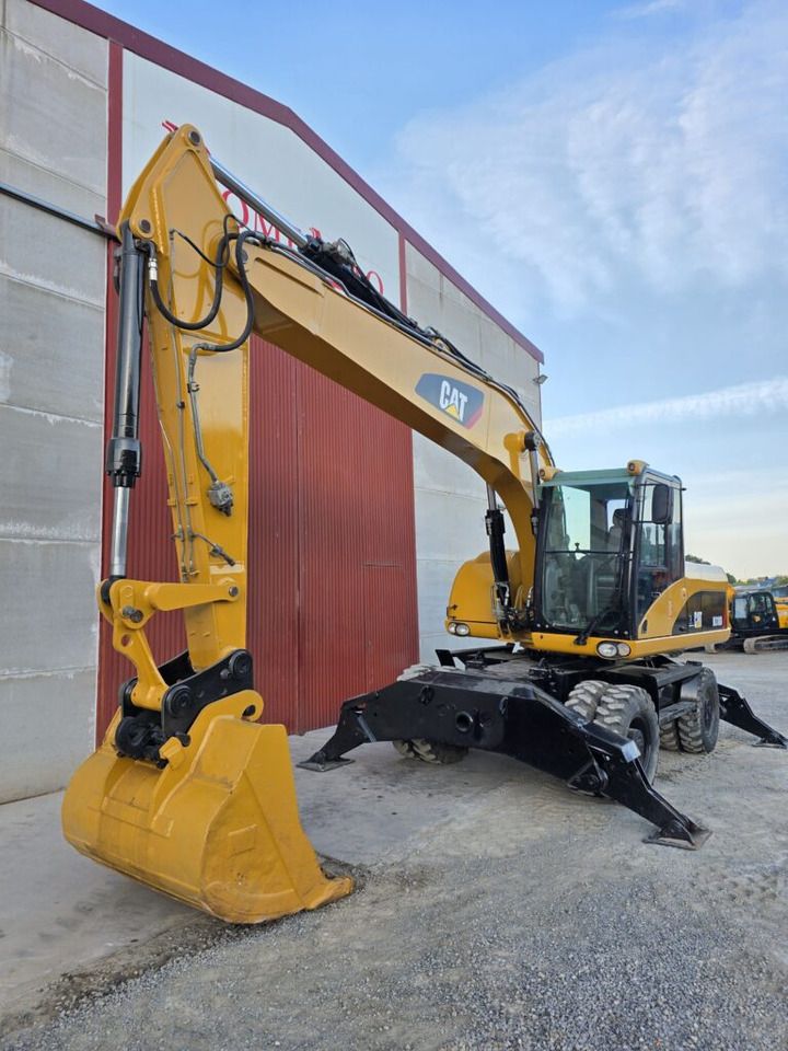 2007 Caterpillar M318D wheel excavator, front three-quarter view