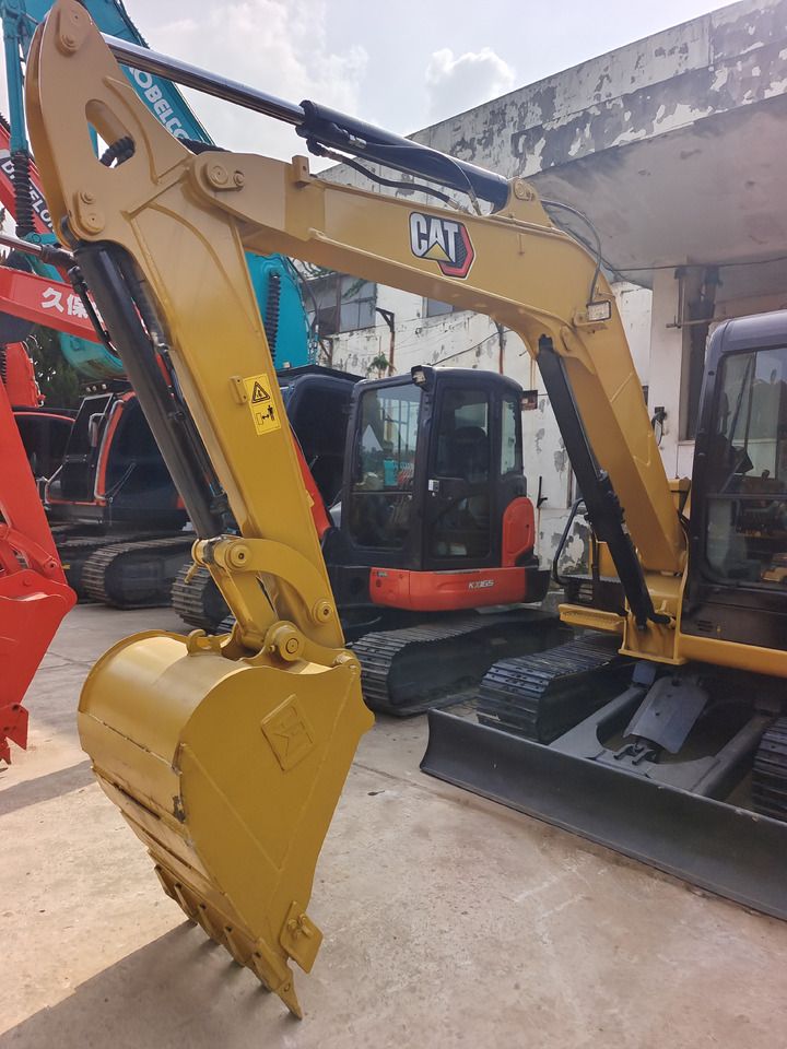 2024 Caterpillar 305.5E2 mini excavator, front three-quarter view 2024 Caterpillar 305.5E2 mini excavator, front three-quarter view