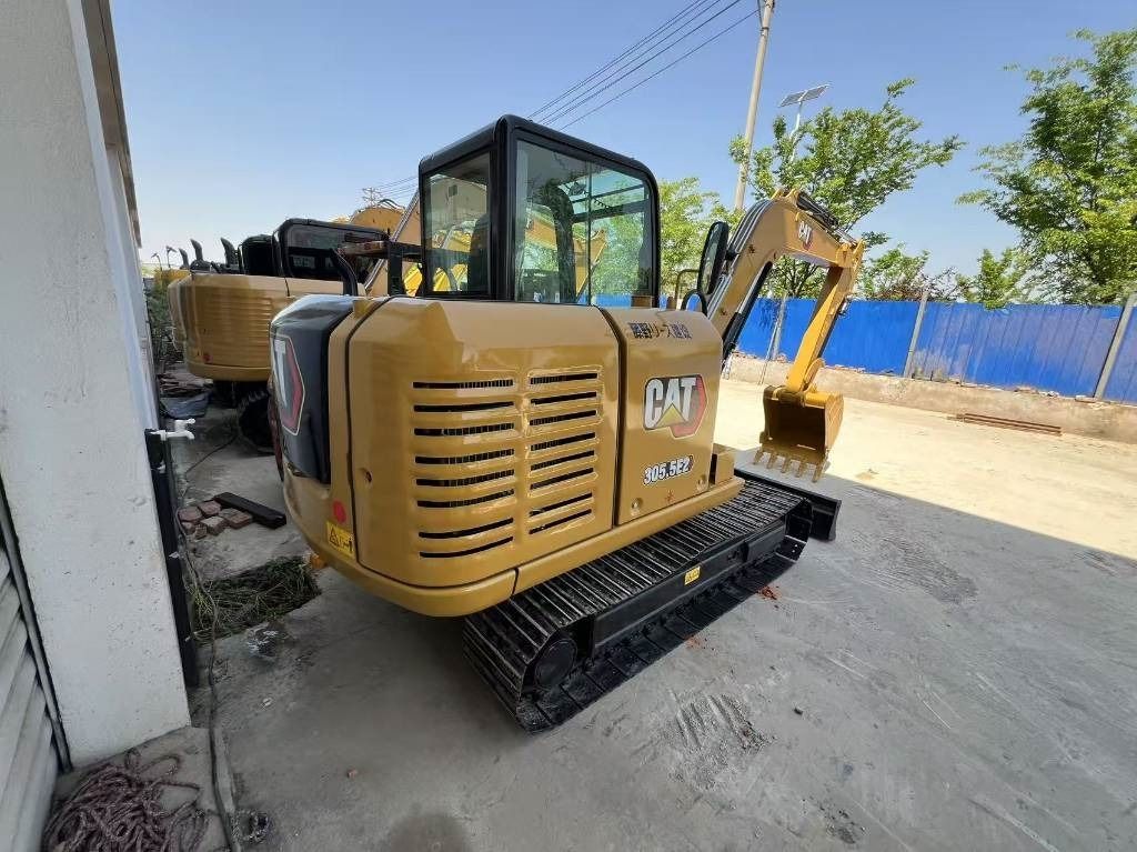 2024 Caterpillar 305.5E2 mini excavator, rear three-quarter view 2024 Caterpillar 305.5E2 mini excavator, rear three-quarter view
