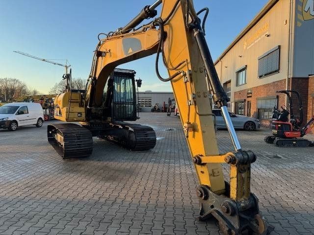 2010 Caterpillar 319DL crawler excavator, side view
