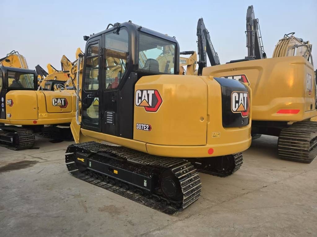 2025 Caterpillar 307E2 mini excavator, rear three-quarter view 2025 Caterpillar 307E2 mini excavator, rear three-quarter view