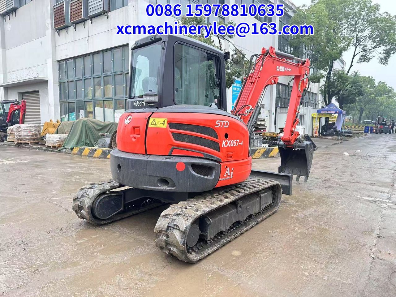 2023 Kubota KX057-4 mini excavator, rear three-quarter view
