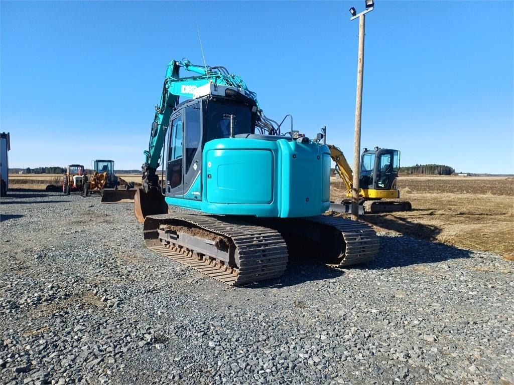 2013 Kobelco SK140SRLC-3 crawler excavator, rear three-quarter view 2013 Kobelco SK140SRLC-3 crawler excavator, rear three-quarter view