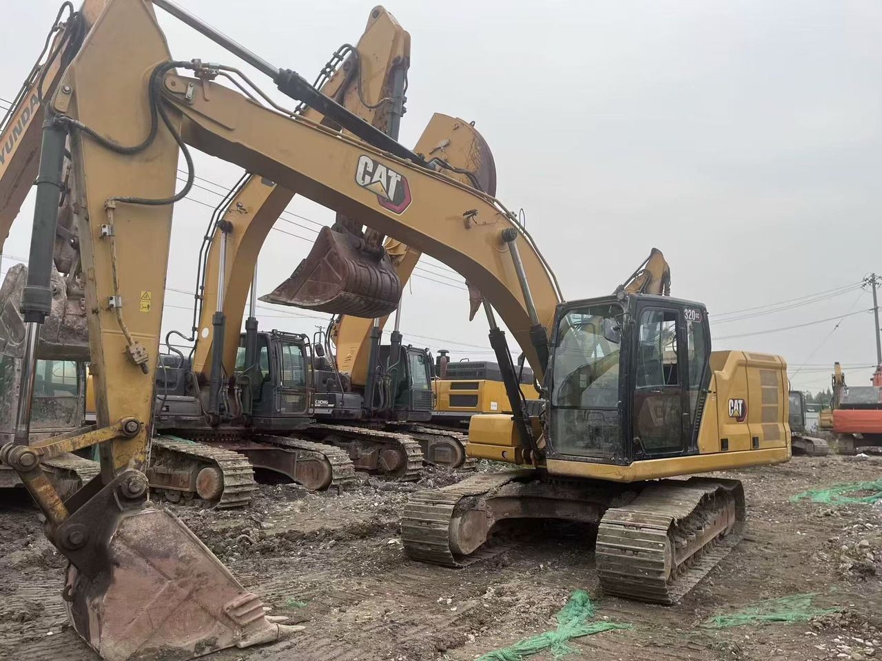 2021 Caterpillar 320GC crawler excavator, front three-quarter view