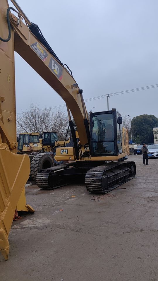 2021 Caterpillar 320GC crawler excavator, front three-quarter view