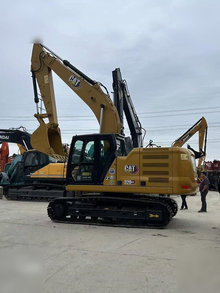 2023 Caterpillar 320GC crawler excavator side view