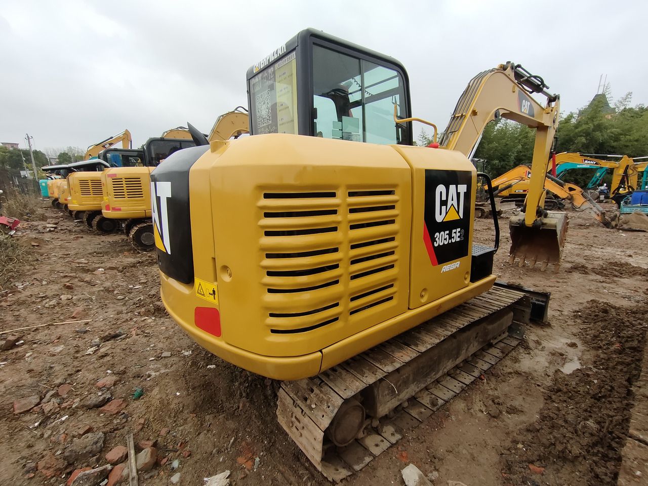 2024 Caterpillar 305.5E2 mini excavator, rear three-quarter view 2024 Caterpillar 305.5E2 mini excavator, rear three-quarter view