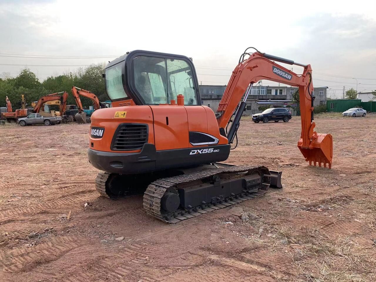 2018 Doosan DX55-9C excavator, rear three-quarter view